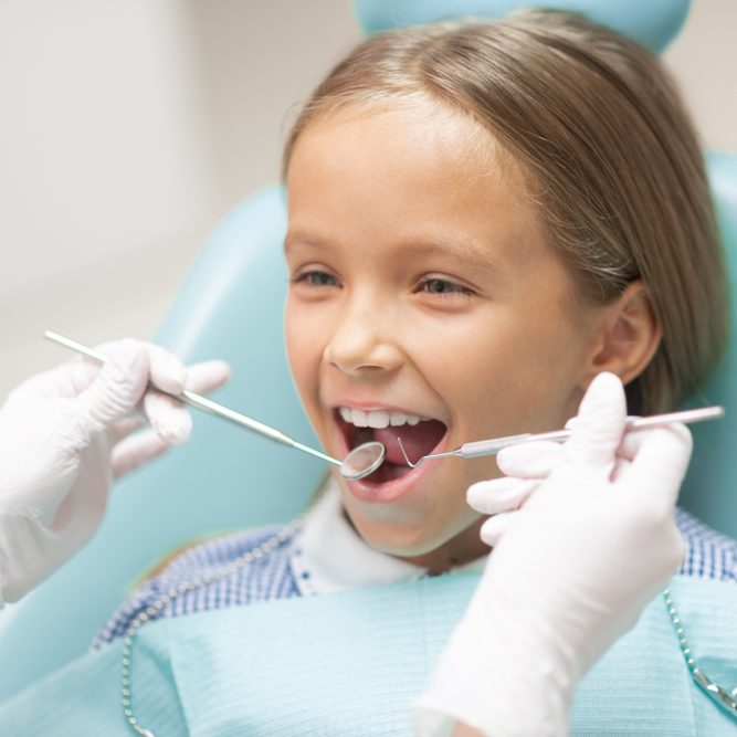 Girl,Smiling.,Cute,Dark-haired,Appealing,Girl,Smiling,While,Visiting,Dentist Girl,Smiling.,Cute,Dark-haired,Appealing,Girl,Smiling,While,Visiting,Dentist
