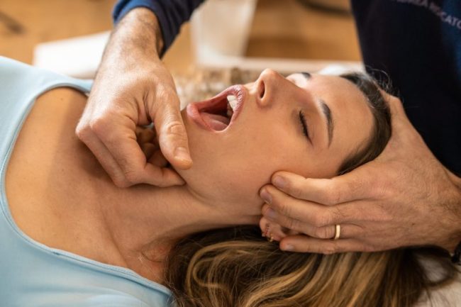 An,Osteopath,Performs,A,Jaw,Adjustment,On,A,Female,Patient, TMJ Therapy alexandria