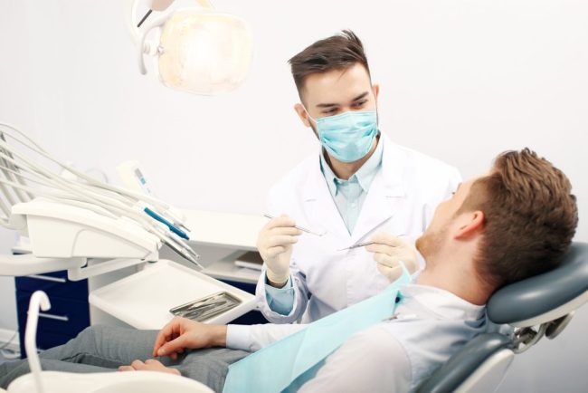 A,Young,Male,Dentist,And,A,Patient.,Dentist,Office,Lifestyle dentist alexandria