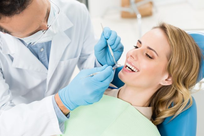Doctor,Treats,Patient,Teeth,In,Modern,Dental,Clinic general dentist in alexandria
