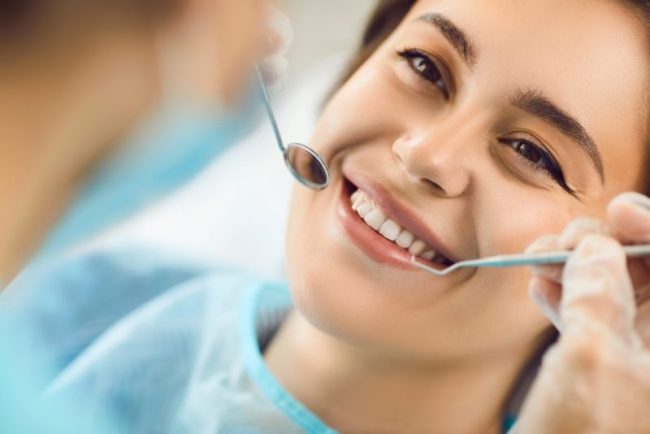 Smiling,Face,Of,A,Woman,At,The,Dentist,,Close-up.,Beautiful dental cleaning near me